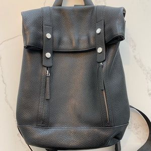 Excellent condition. Genuine pebbled leather, gorgeous backpack.